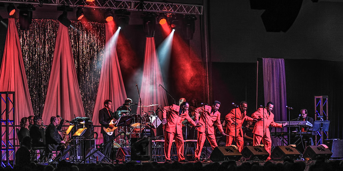 The Motown troupe on stage singing