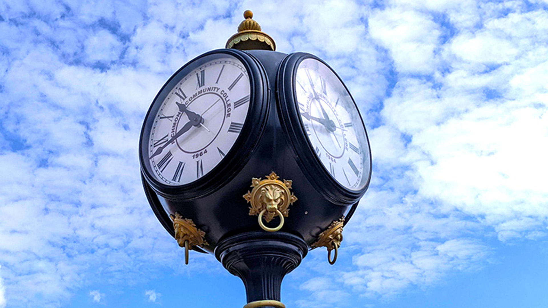 Clock face with sky in the background